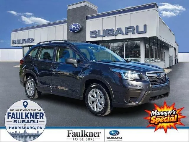 2019 Subaru Forester 2.5i in Dark Gray Metallic — front three-quarter view