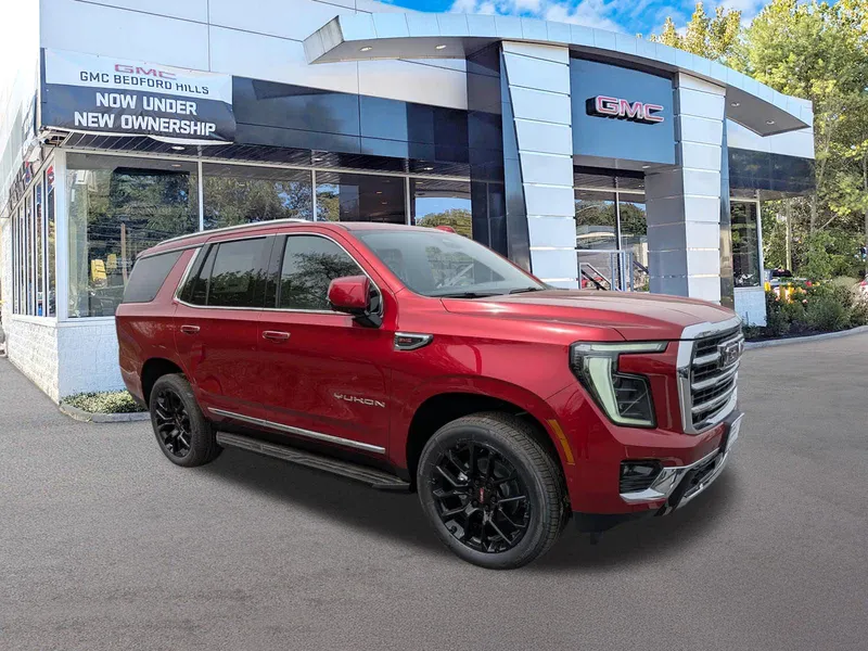 2026 GMC Yukon Elevation in Volcanic Red Tintcoat — front three-quarter view