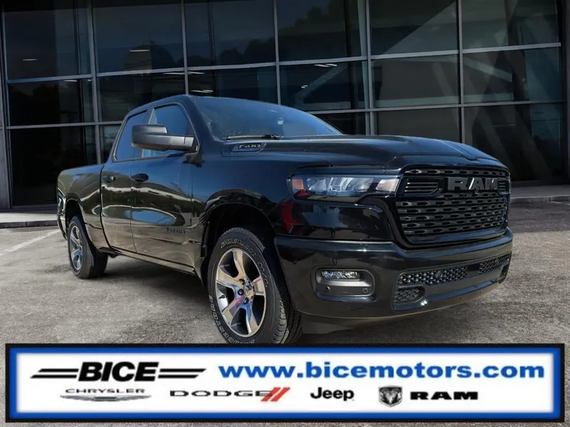 2026 RAM Ram 1500 Express Quad Cab 4x2 in Diamond Black Crystal Pearl-Coat Exterior Paint — front three-quarter view