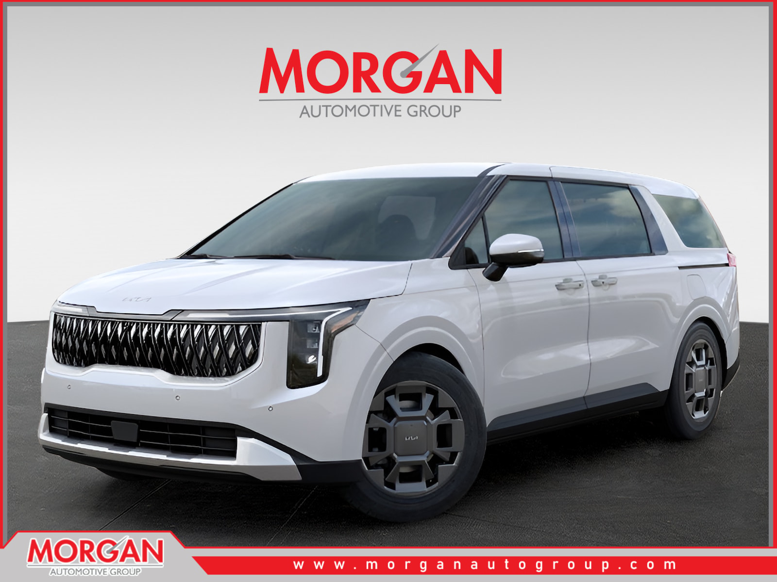 2026 Kia Carnival Hybrid EX in Snow White Pearl — front three-quarter view