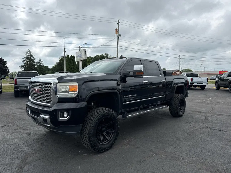 2016 GMC Sierra 2500 HD Denali in Onyx Black — front three-quarter view