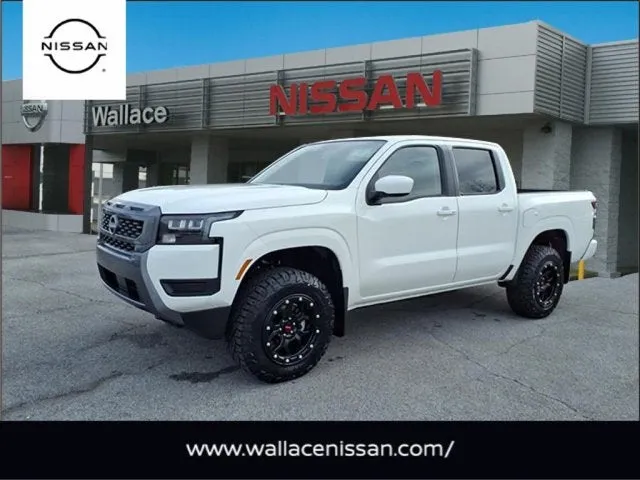 2026 Nissan Frontier SV in Glacier White Qak — front three-quarter view