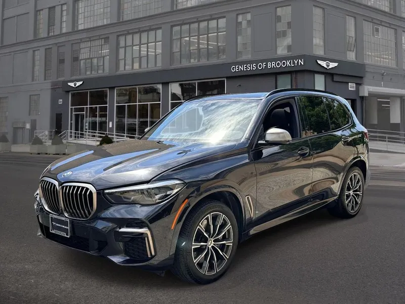 2022 BMW X5 M50i in Black Sapphire Metallic — front three-quarter view