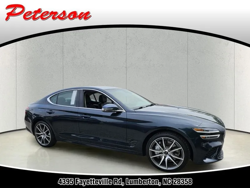 2025 Genesis G70 2.5T AWD in Tasman Blue — front three-quarter view