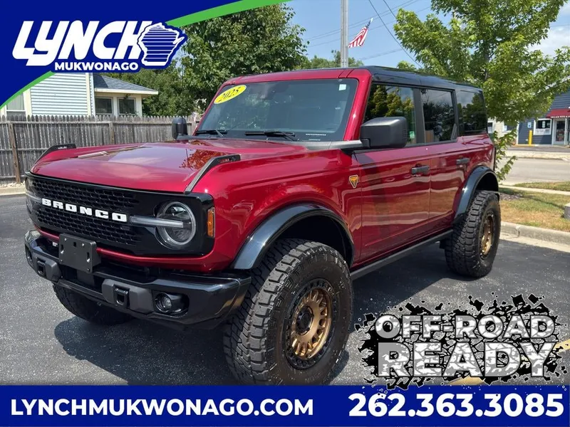 2025 Ford Bronco Badlands in Ruby Red Metallic Tinted Clearcoat — front three-quarter view