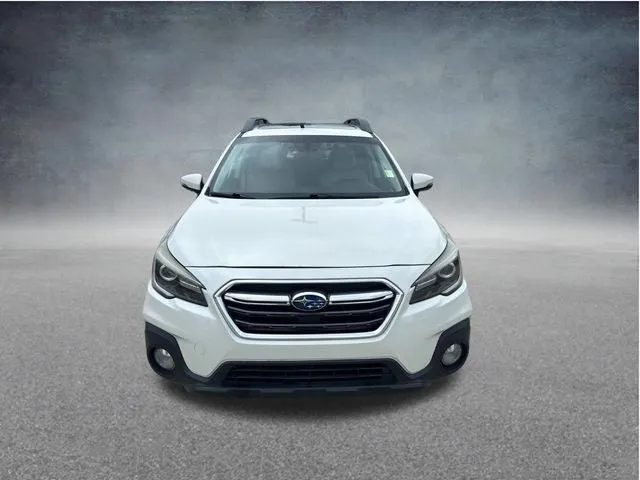 2019 Subaru Outback Limited in Crystal White Pearl — front three-quarter view