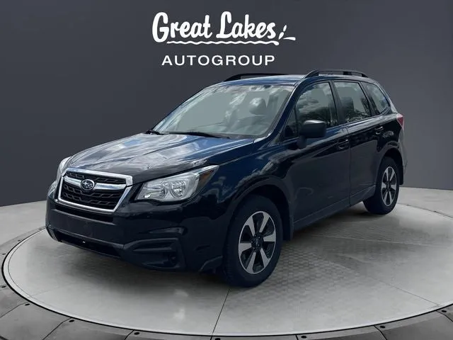 2017 Subaru Forester 2.5i in Crystal Black Silica — front three-quarter view