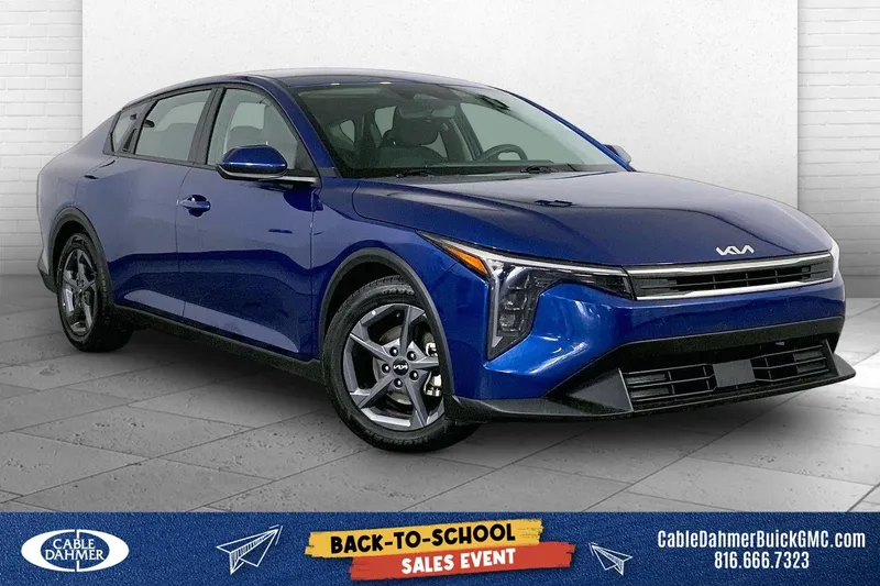 2025 Kia K4 LXS in Deep Sea Blue — front three-quarter view