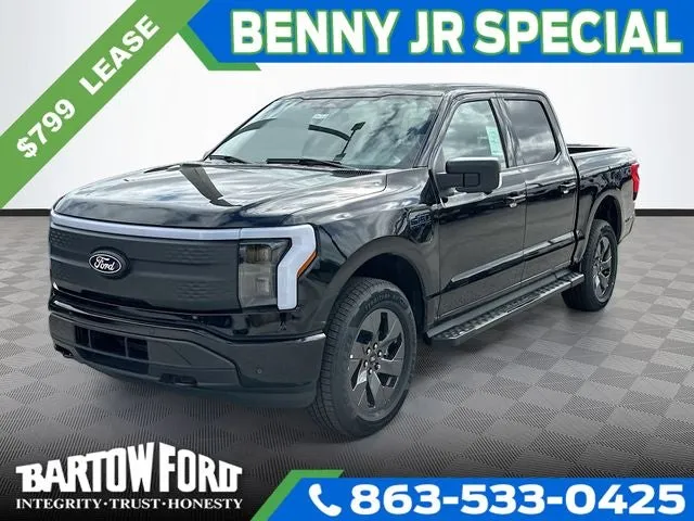 2025 Ford F-150 Lightning Flash in Black Metallic — front three-quarter view
