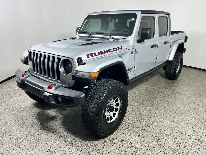 2023 Jeep Gladiator Rubicon in Silver Zynith Clearcoat — front three-quarter view