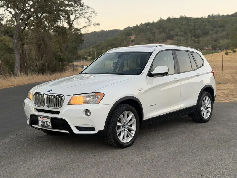 2014 BMW X3 in White — front three-quarter view