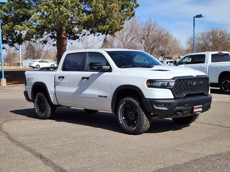 2026 RAM 1500 RAM 1500 REBEL CREW CAB 4X4 5'7' BOX in Bright White Clear-Coat Exterior Paint — front three-quarter view