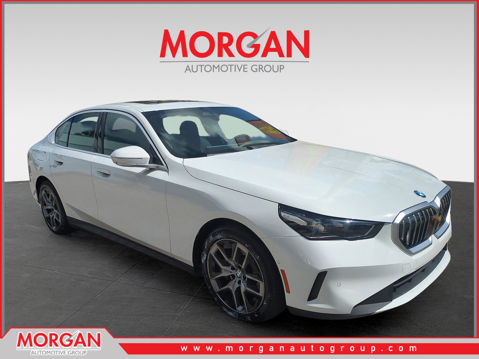 2026 BMW 5 Series 530i in Alpine White — front three-quarter view