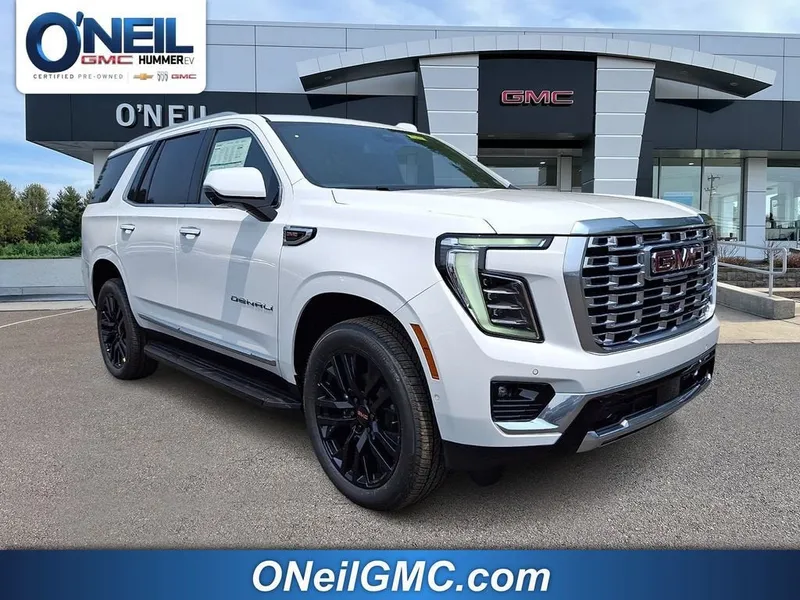 2026 GMC Yukon Denali in Summit White — front three-quarter view