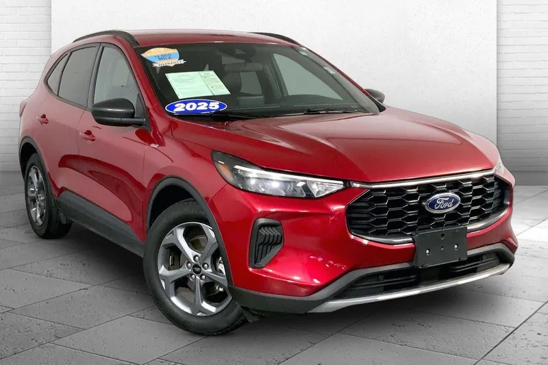 2025 Ford Escape ST-Line in Rapid Red Metallic Tinted Clearcoat — front three-quarter view