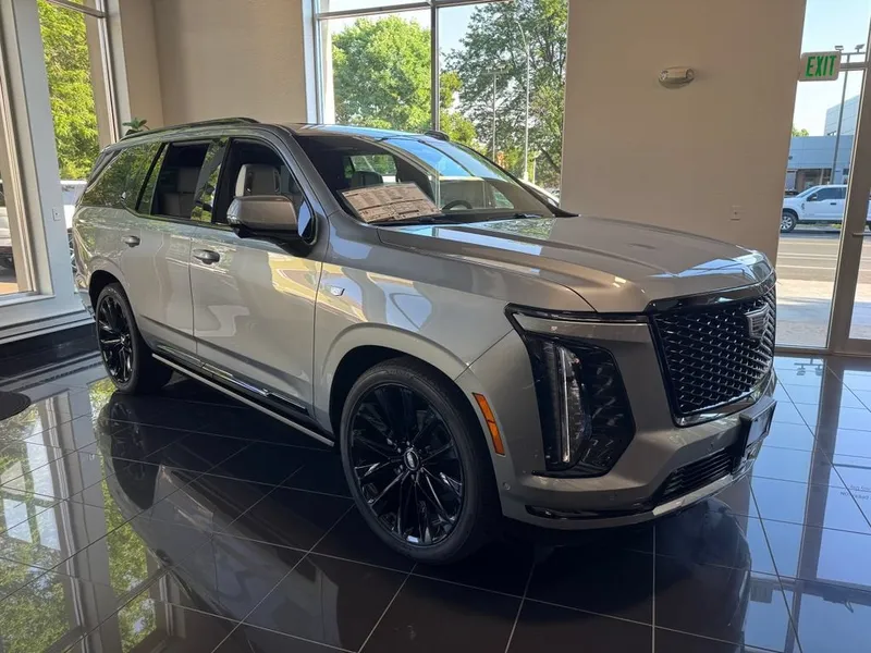 2026 Cadillac Escalade Platinum Sport in Argent Silver Metallic — front three-quarter view