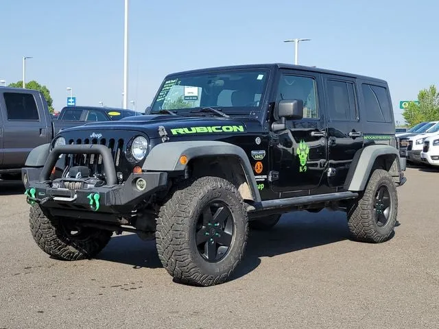 2012 Jeep Wrangler Unlimited Rubicon in Black Clearcoat — front three-quarter view