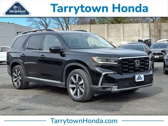 2025 Honda Pilot Elite in Crystal Black Pearl — front three-quarter view