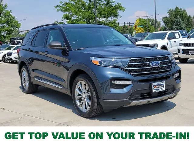 2023 Ford Explorer XLT in Stone Blue Metallic — front three-quarter view