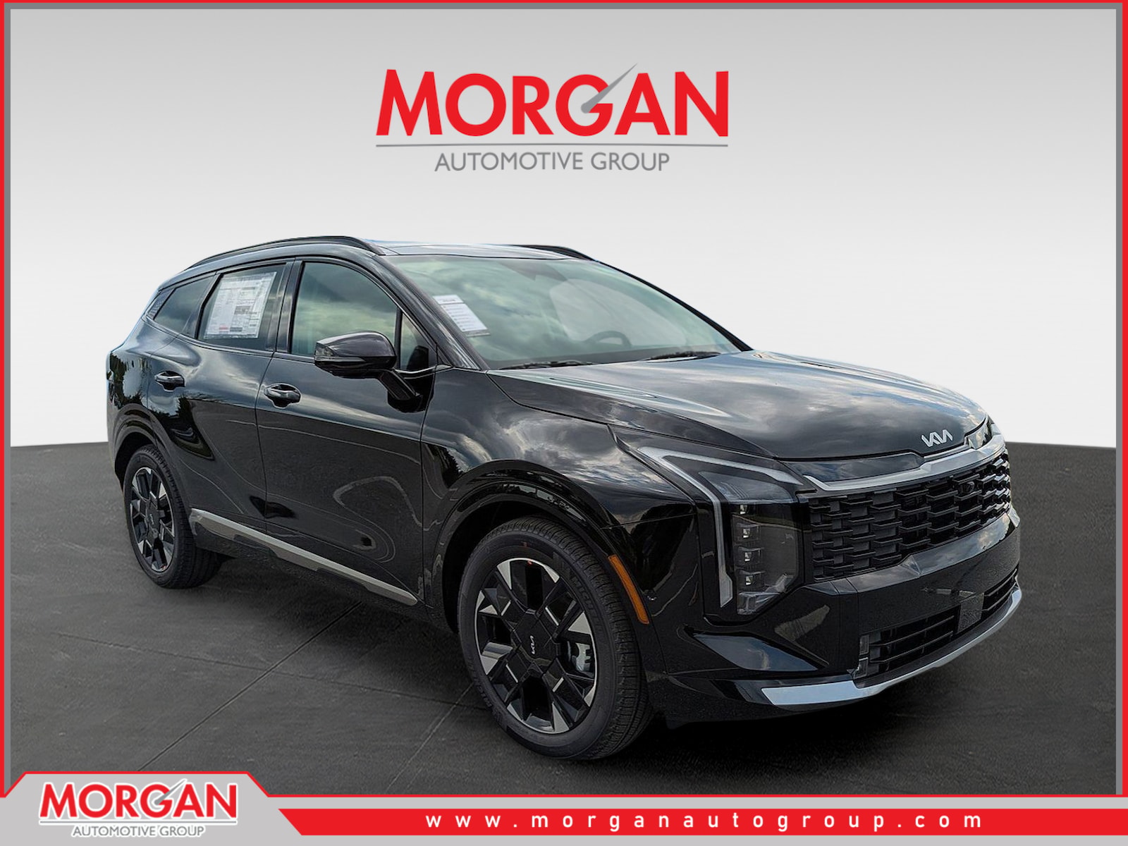 2026 Kia Sportage SX-Prestige in Ebony Black — front three-quarter view