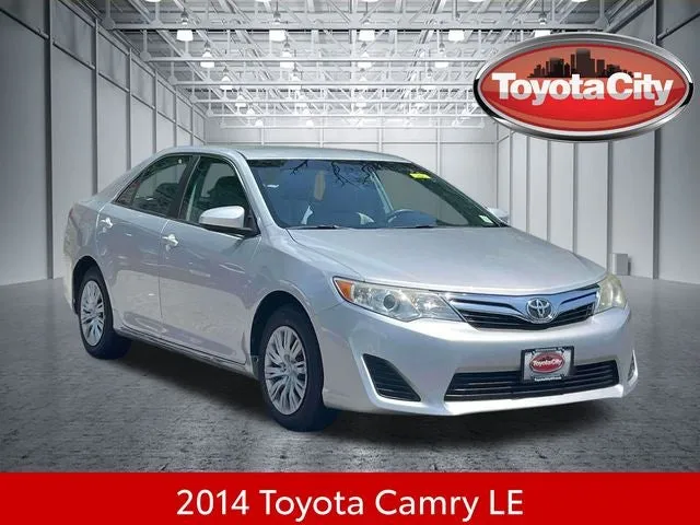 2014 Toyota Camry LE in Classic Silver Metallic — front three-quarter view