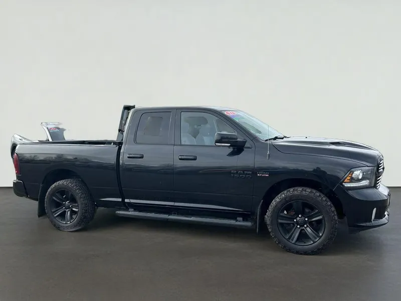 2017 RAM 1500 Sport in Brilliant Black Crystal Pearlcoat — front three-quarter view