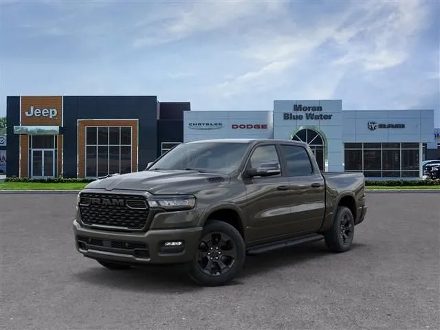 2026 RAM Ram 1500 RAM 1500 BIG HORN CREW CAB 4X4 5'7' BOX in Tank Exterior Paint — front three-quarter view