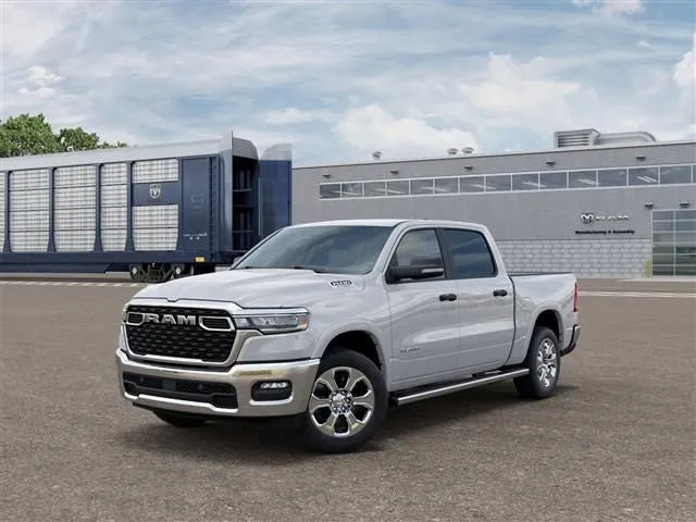 2026 RAM Ram 1500 RAM 1500 BIG HORN CREW CAB 4X4 5'7' BOX in Bright White Clear-Coat Exterior Paint — front three-quarter view