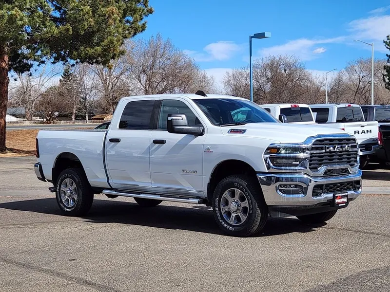2026 RAM 2500 RAM 2500 BIG HORN CREW CAB 4X4 6'4' BOX in Bright White Clear-Coat Exterior Paint — front three-quarter view