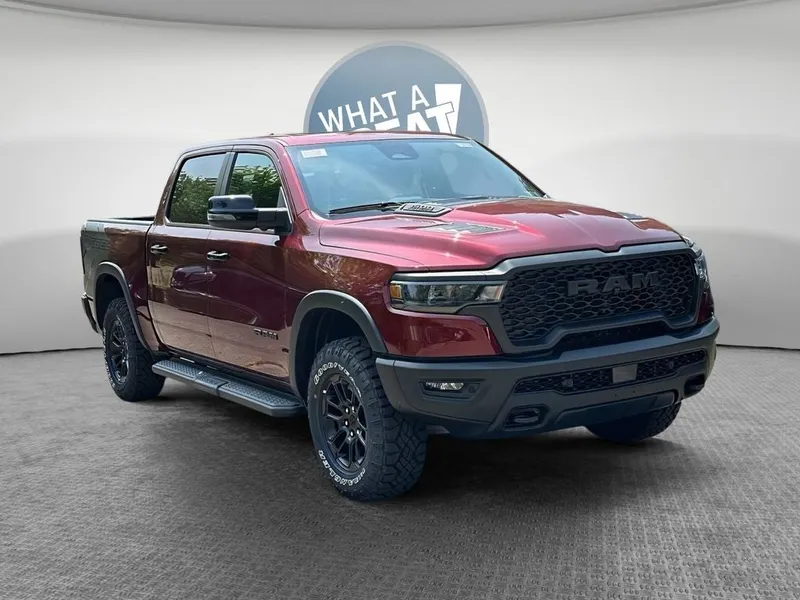 2026 RAM 1500 RAM 1500 REBEL CREW CAB 4X4 5'7' BOX in Delmonico Red Pearl-Coat Exterior Paint — front three-quarter view