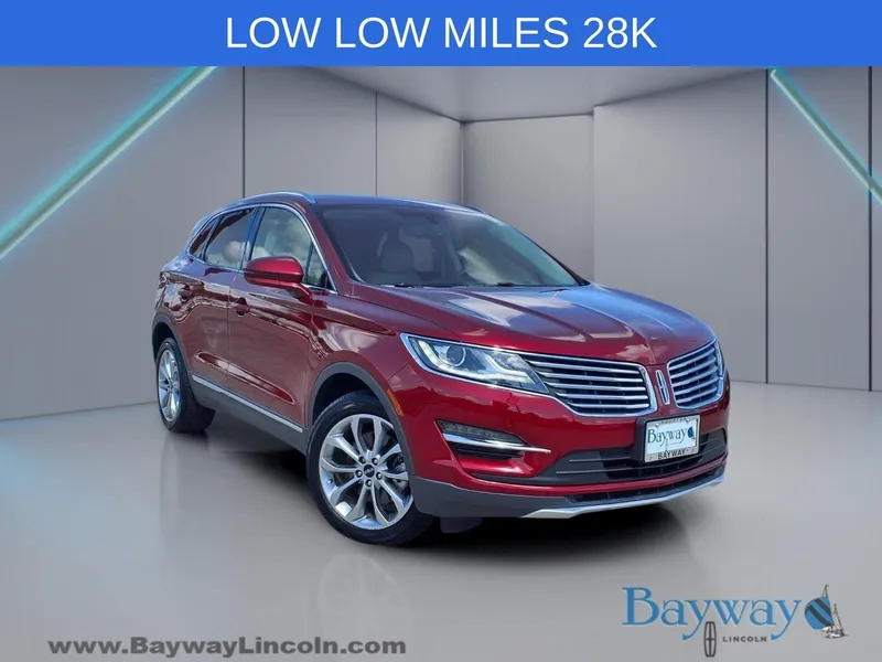 2018 Lincoln MKC Select in Ruby Red Metallic — front three-quarter view
