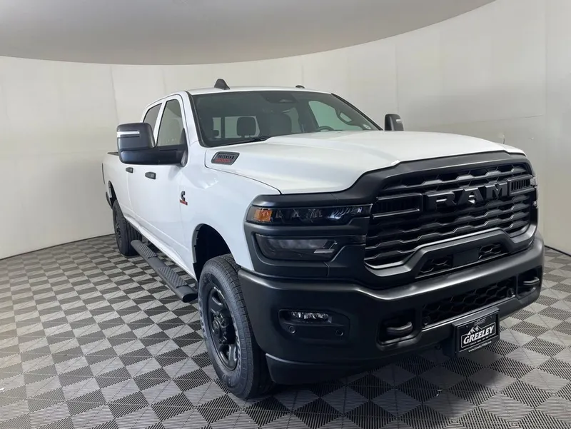 2026 RAM 2500 RAM 2500 TRADESMAN CREW CAB 4X4 8' BOX in Bright White Clear-Coat Exterior Paint — front three-quarter view