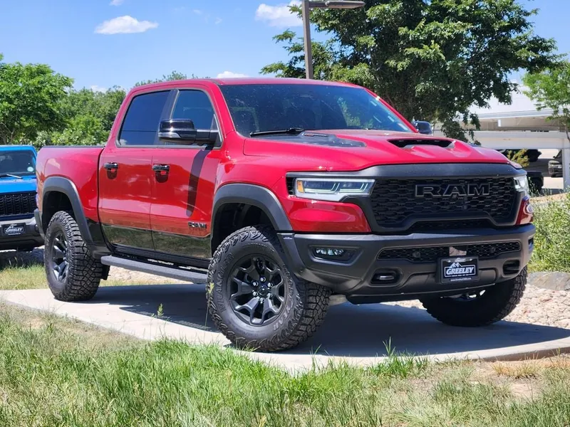 2026 RAM 1500 RAM 1500 RHO CREW CAB 4X4 5'7' BOX in Molten Red Pearl-Coat Exterior Paint — front three-quarter view