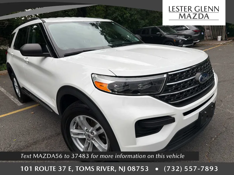 2023 Ford Explorer XLT in Star White Metallic Tri-Coat — front three-quarter view