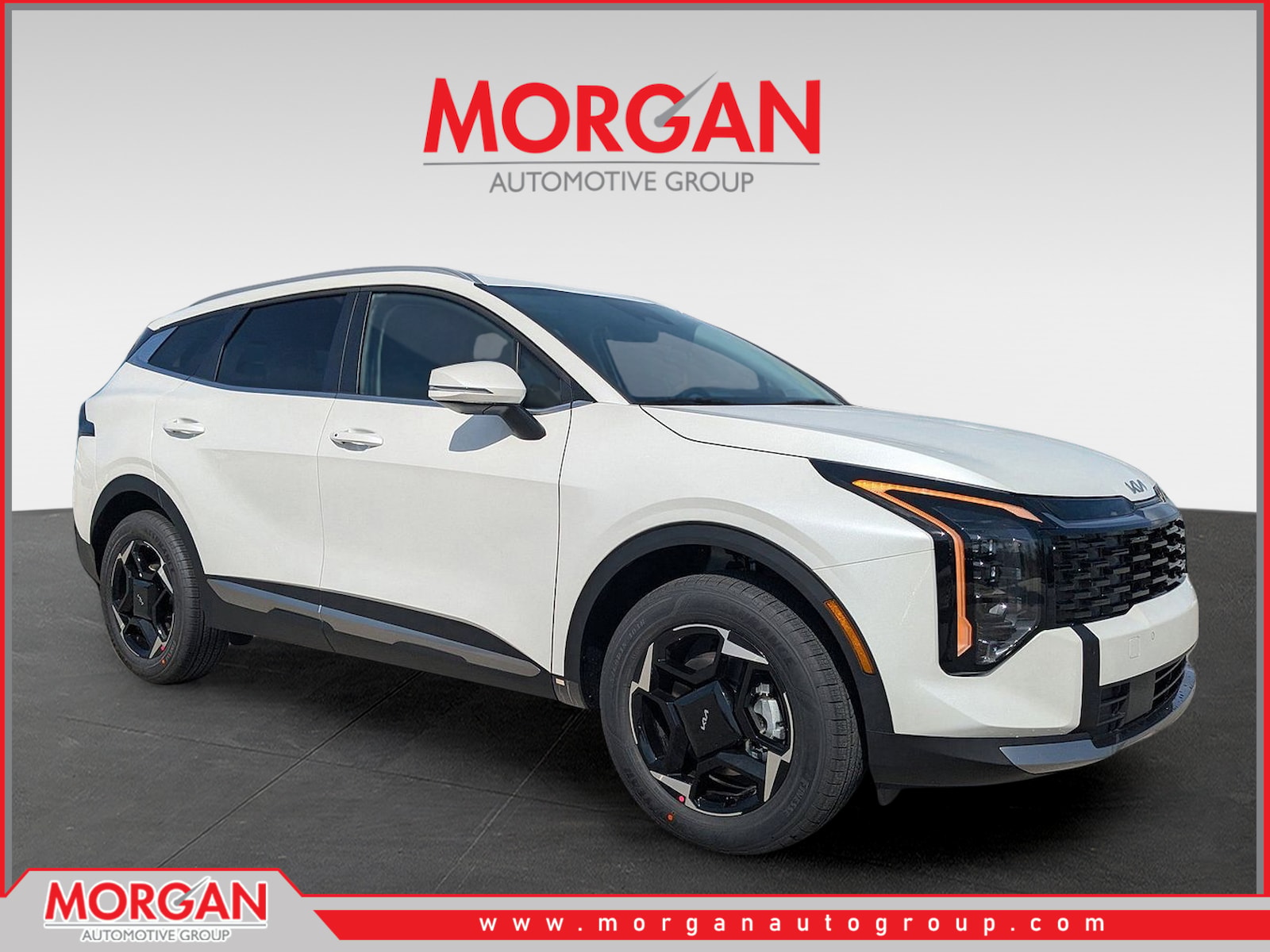 2026 Kia Sportage Hybrid EX in Snow White Pearl — front three-quarter view