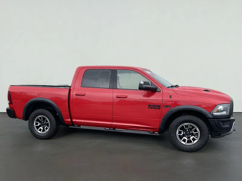 2016 RAM 1500 Rebel in Flame Red Clearcoat — front three-quarter view