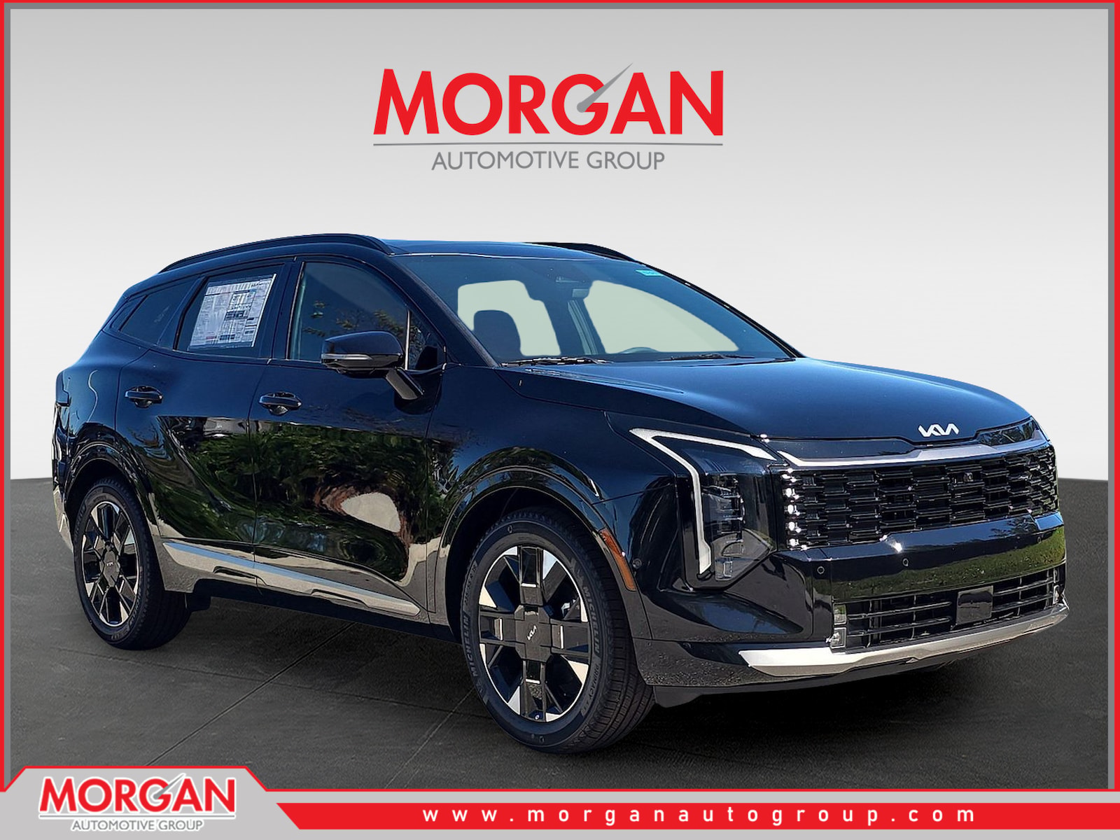 2026 Kia Sportage SX-Prestige in Ebony Black — front three-quarter view