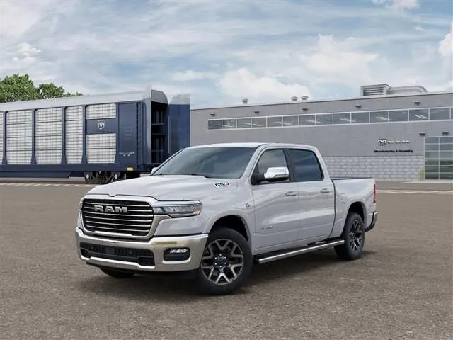 2026 RAM Ram 1500 RAM 1500 LARAMIE CREW CAB 4X4 5'7' BOX in Bright White Clear-Coat Exterior Paint — front three-quarter view