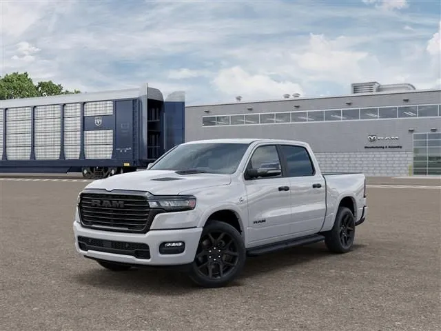 2026 RAM Ram 1500 RAM 1500 LARAMIE CREW CAB 4X4 5'7' BOX in Bright White Clear-Coat Exterior Paint — front three-quarter view