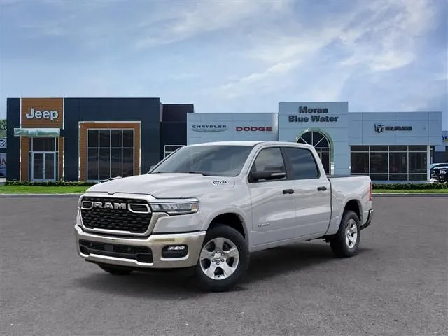 2026 RAM Ram 1500 RAM 1500 BIG HORN CREW CAB 4X4 5'7' BOX in Bright White Clear-Coat Exterior Paint — front three-quarter view