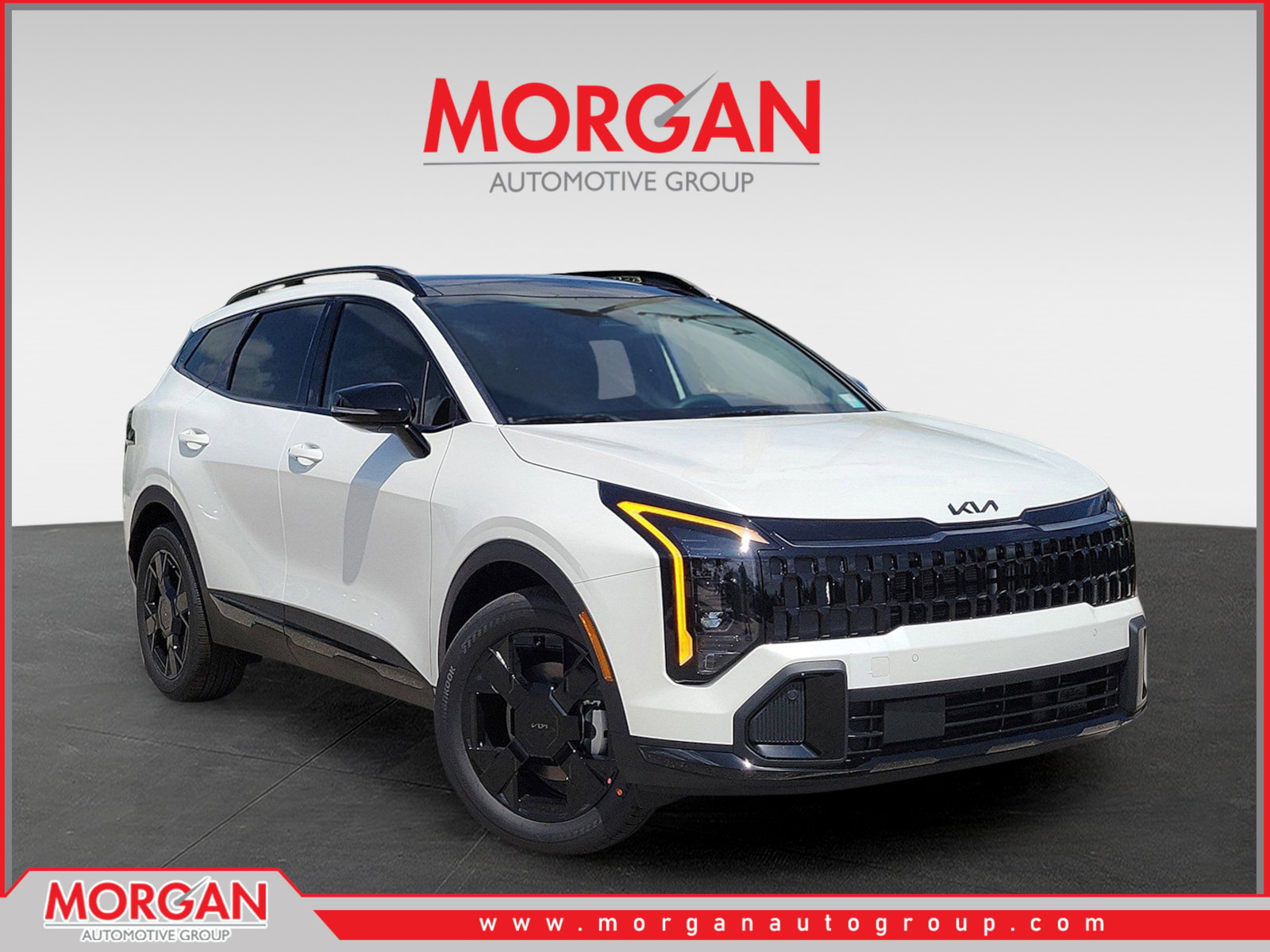 2026 Kia Sportage Hybrid X-Line in Snow White Pearl — front three-quarter view