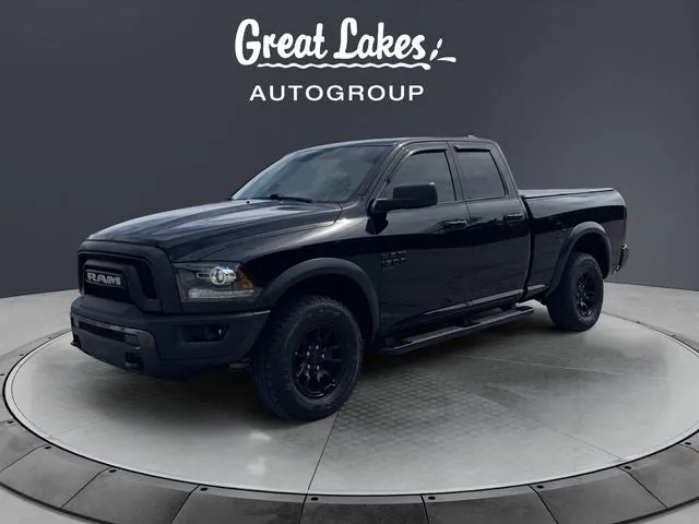 2021 RAM 1500 Classic Warlock in Diamond Black Crystal Pearlcoat — front three-quarter view
