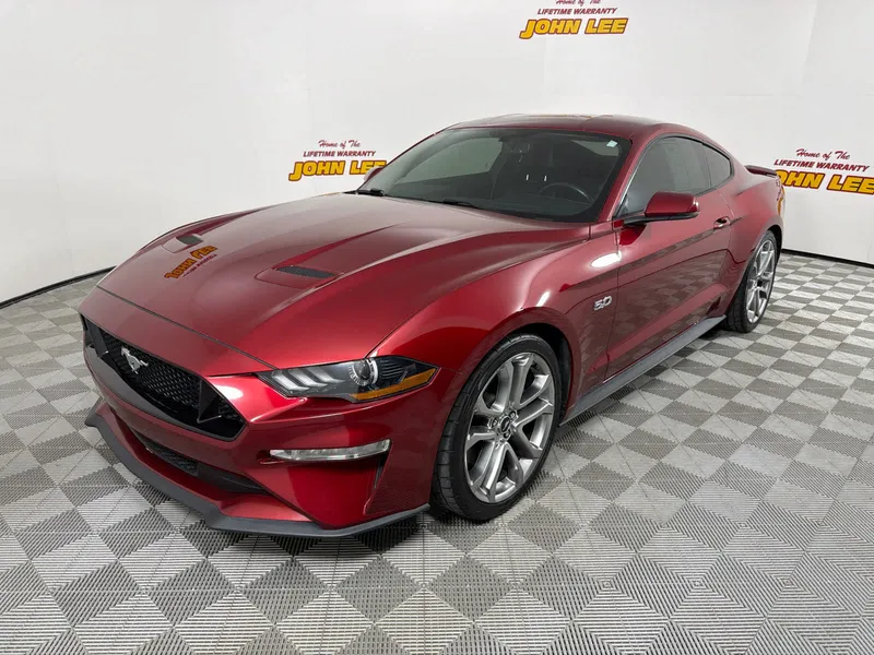 2019 Ford Mustang GT Premium in Ruby Red Metallic Tinted Clearcoat — front three-quarter view