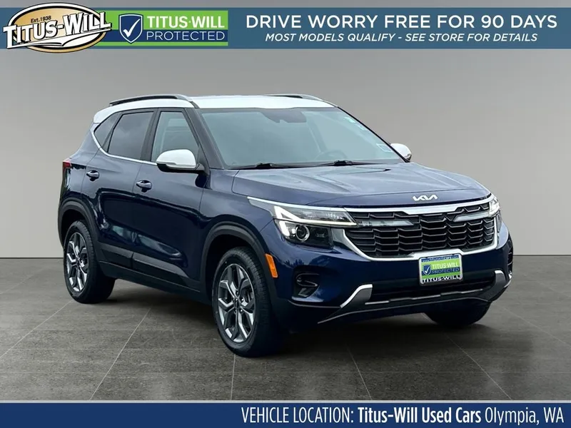 2024 Kia Seltos S in Dark Ocean Blue/White Roof — front three-quarter view