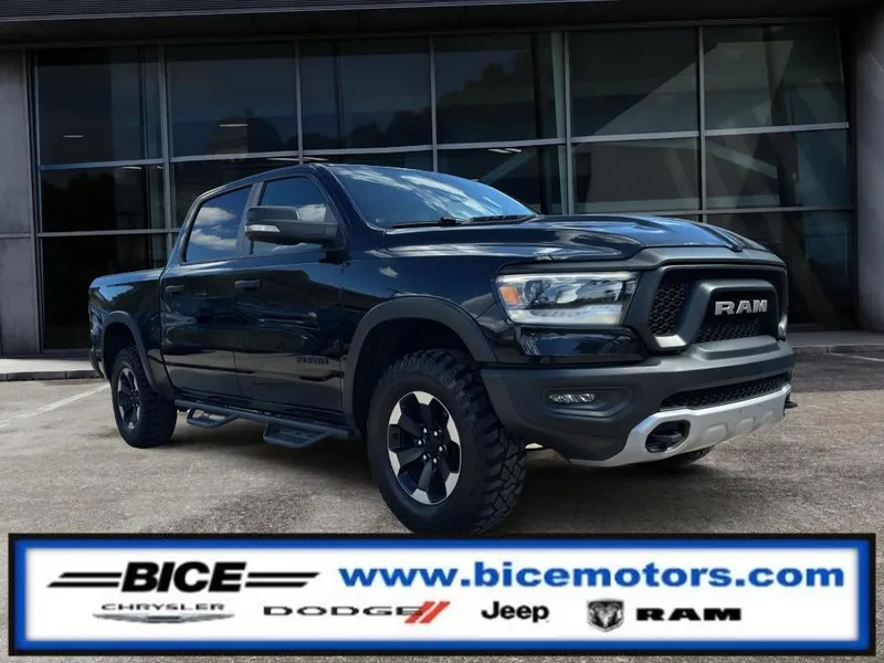 2021 RAM 1500 Rebel in Diamond Black Crystal Pearlcoat — front three-quarter view