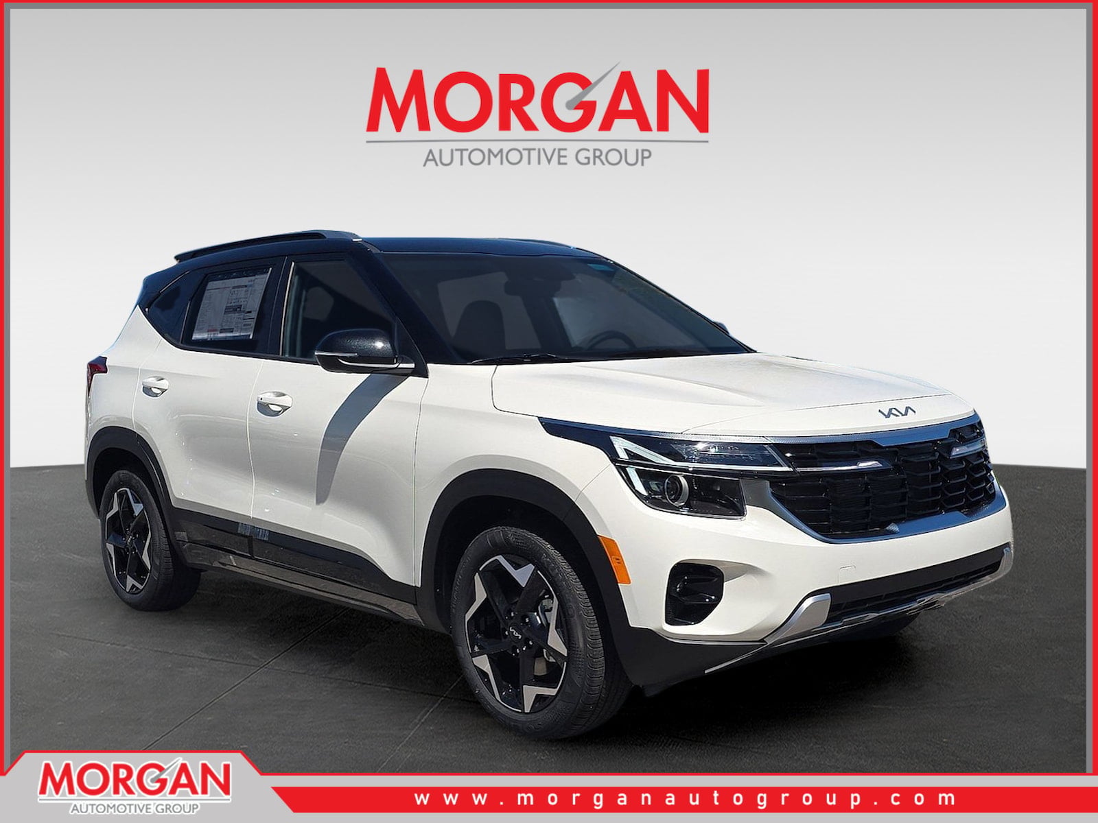 2026 Kia Seltos S in Clear White/Black Roof — front three-quarter view
