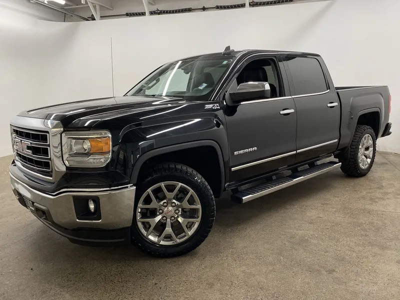 2015 GMC Sierra 1500 SLT in Onyx Black — front three-quarter view