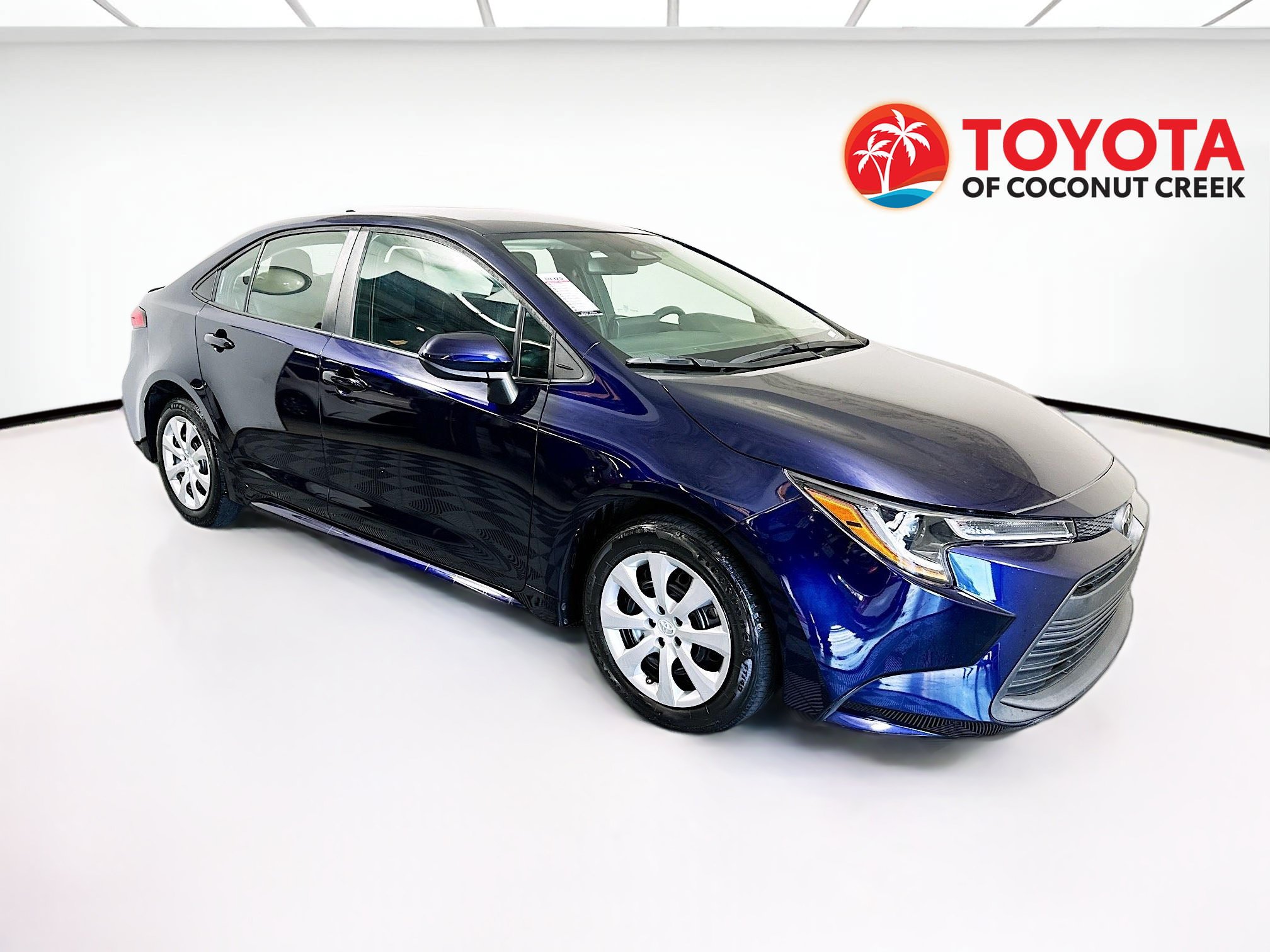 2024 Toyota Corolla LE in Blueprint — front three-quarter view