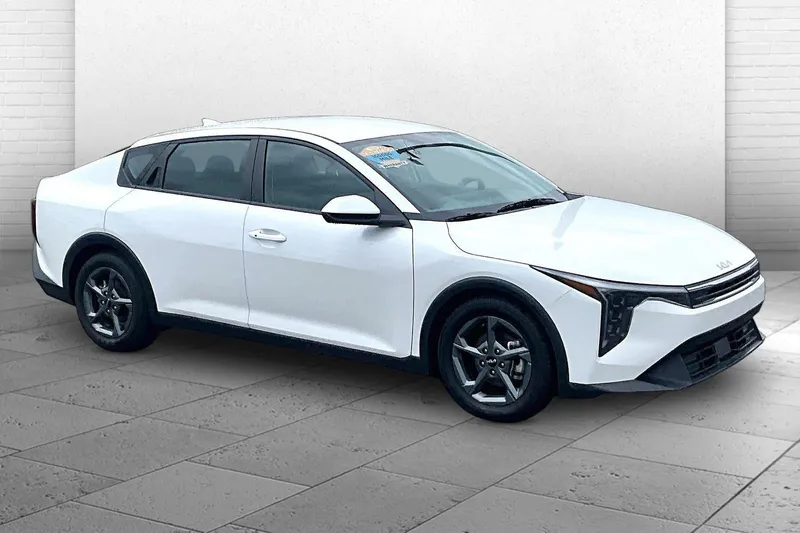 2025 Kia K4 LXS in Snow White Pearl — front three-quarter view