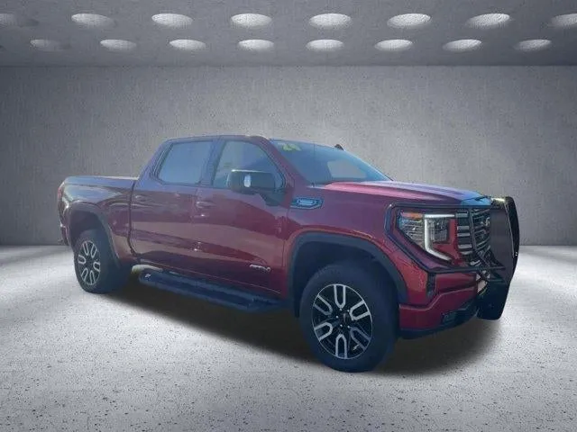 2024 GMC Sierra 1500 AT4 in Volcanic Red Tintcoat — front three-quarter view